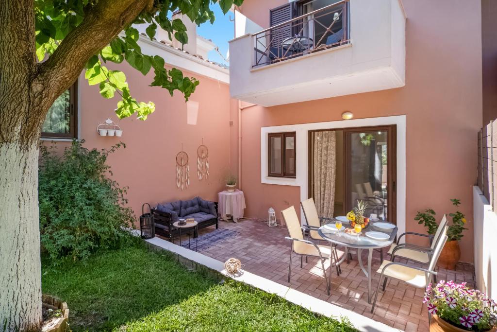 a patio in a house with a table and chairs at Villa prolithia 2 in Vlikhón