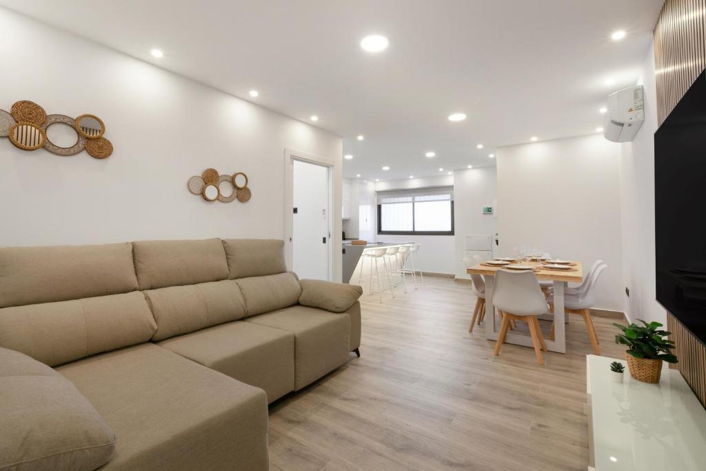 a living room with a couch and a table at Apartamento Avenida Marítima in Candelaria