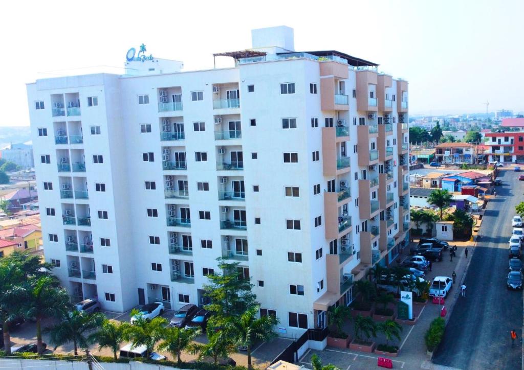 an aerial view of a white apartment building at OASIS PARK RESIDENCE in East Legon