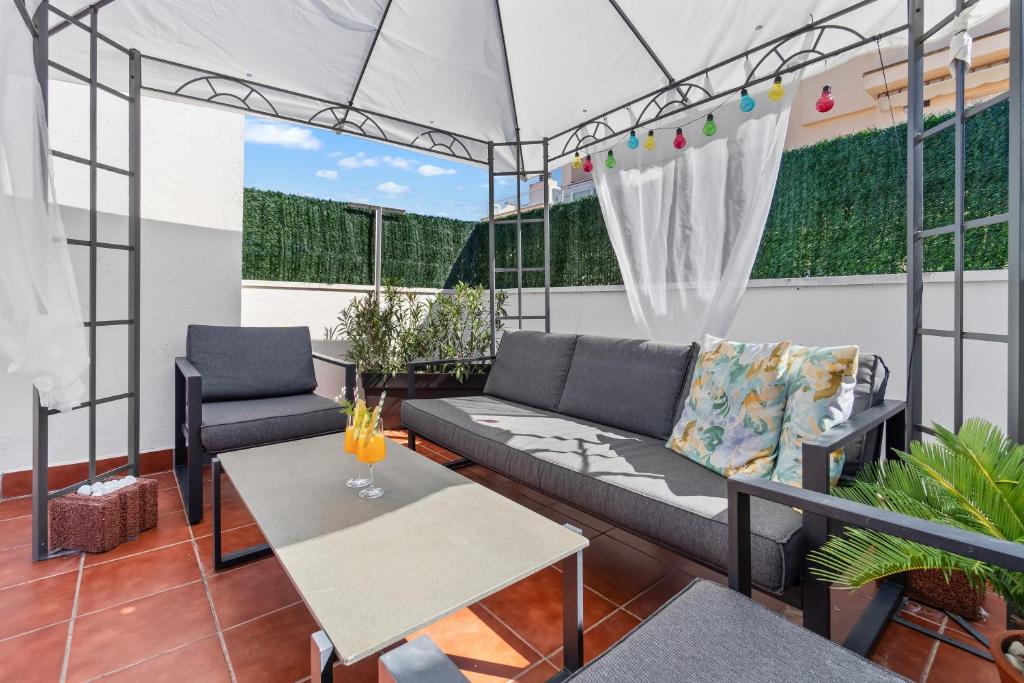 a living room with a couch and a table at Casa Deti in Roses