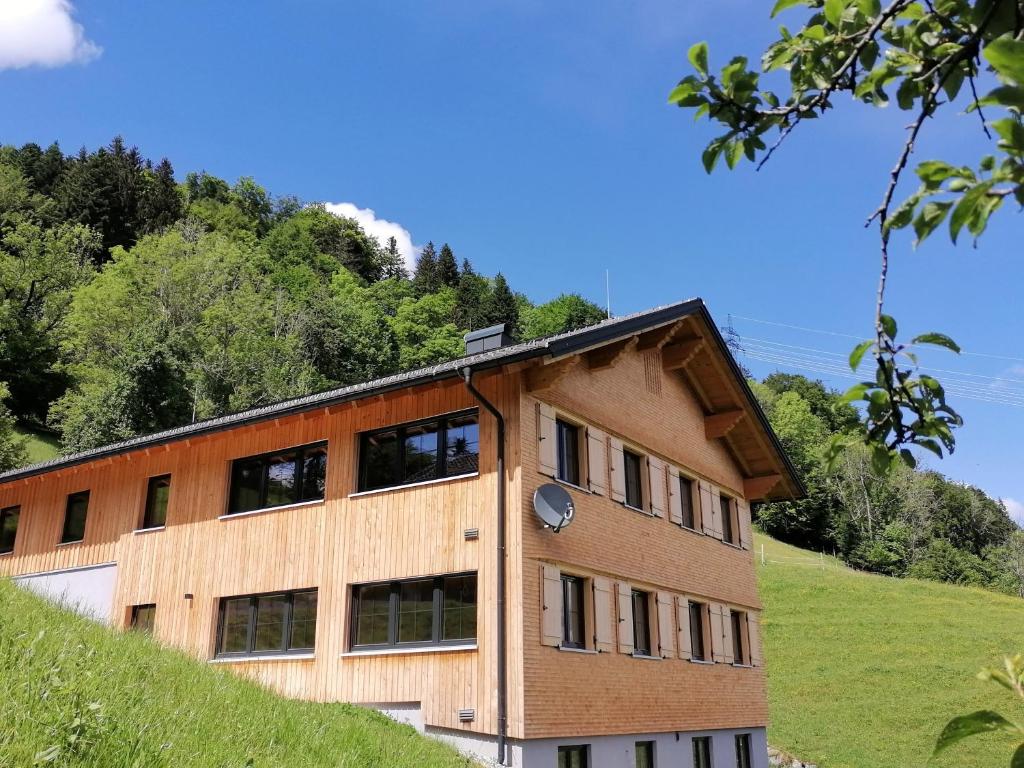 a building on the side of a hill at Ferienwohnung Naturnah in Dalaas