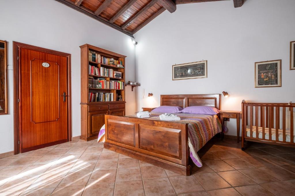 a bedroom with a bed and a book shelf at Casaletto della musica in Viterbo