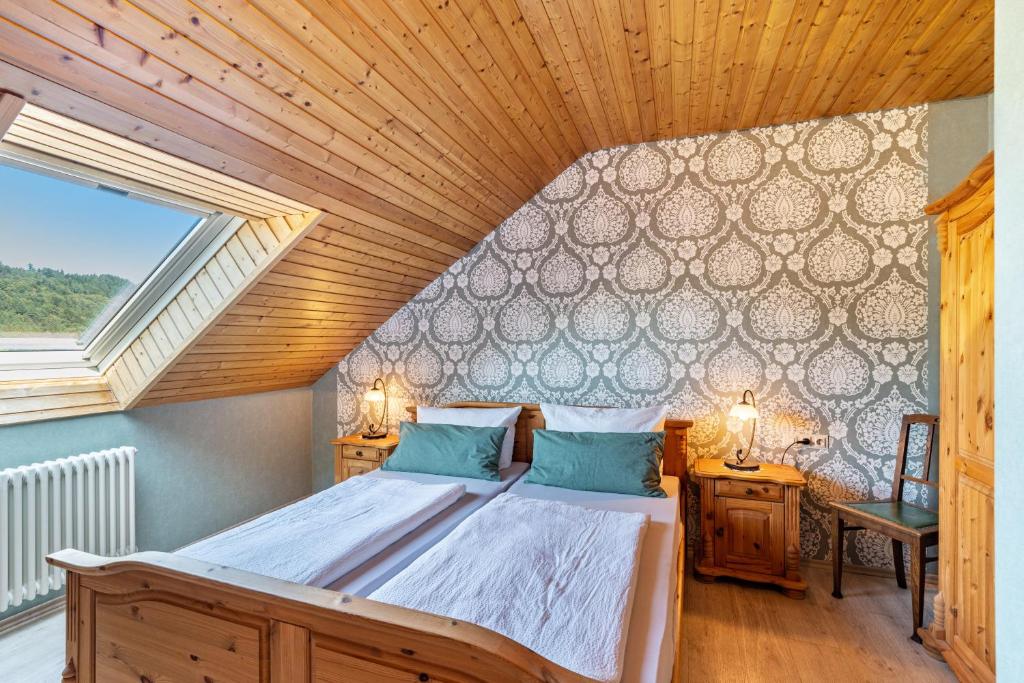 a bedroom with a bed in a room with a window at Haus Berger in Seebach