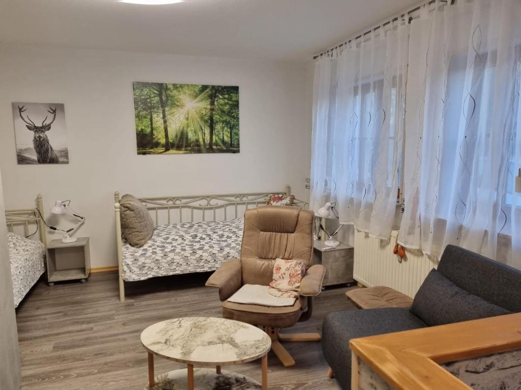 a living room with a couch and a bed at Ferienwohnung Kuckuck in Ohlsbach