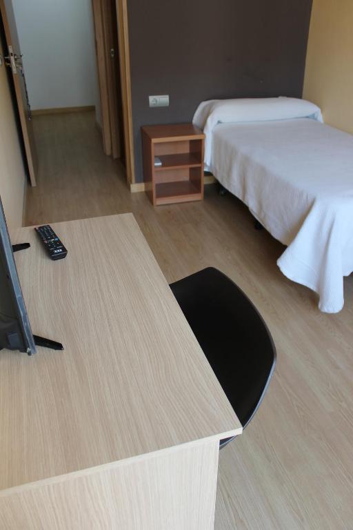 Postel nebo postele na pokoji v ubytování Hostal Cal Siles