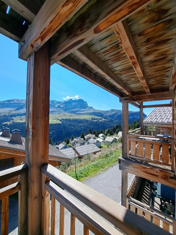a view from the balcony of a log cabin at Superbe Duplex- Résidence Alpine in Arâches-la-Frasse