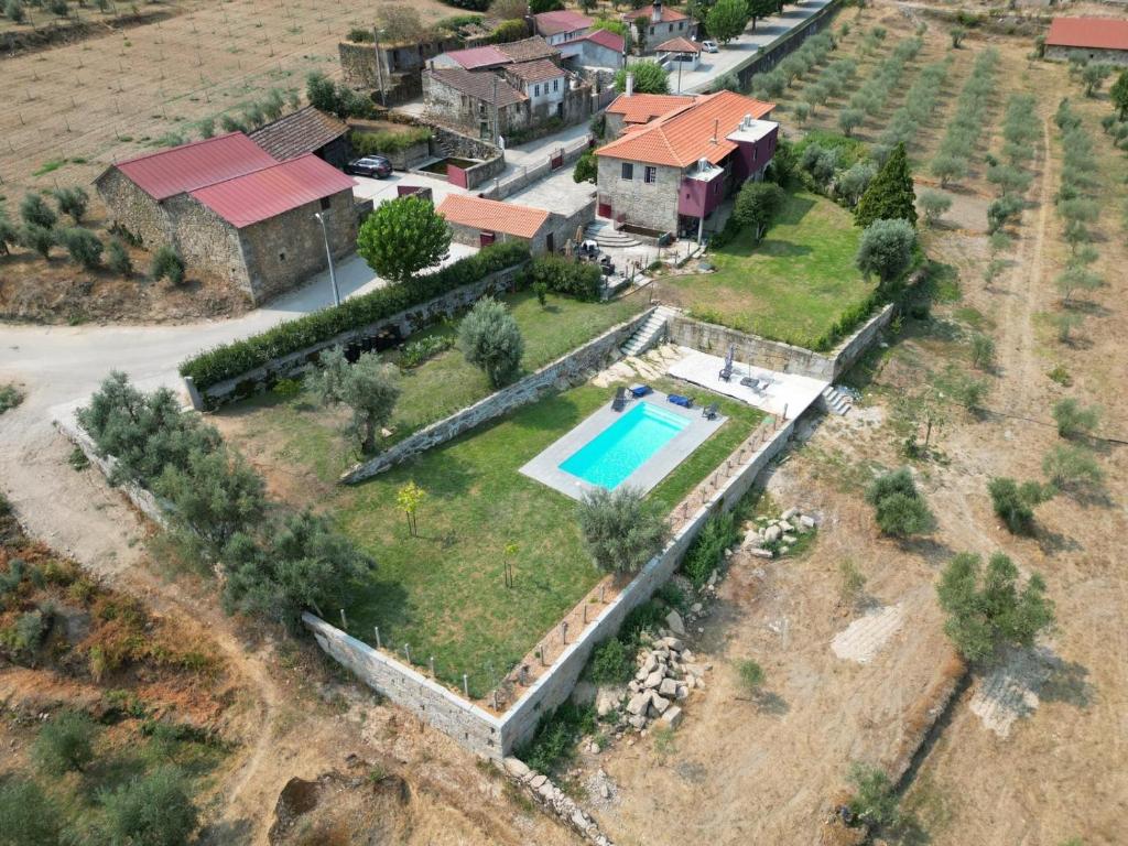 an aerial view of a house with a swimming pool at Casa De Vilar do Dão in Penalva do Castelo