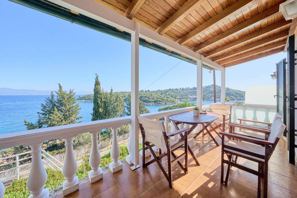 a view from the balcony of a house with a table and chairs at Dolphin villa 2 in Gaios