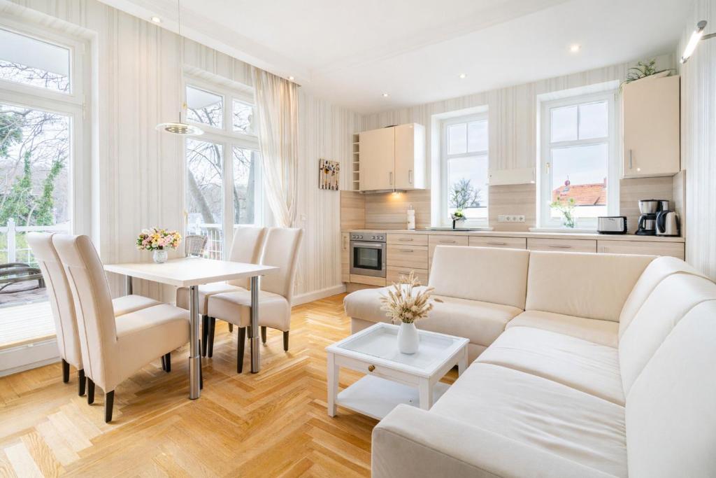 a living room with a couch and a table at Villa Gruner Nr 13 in Zinnowitz