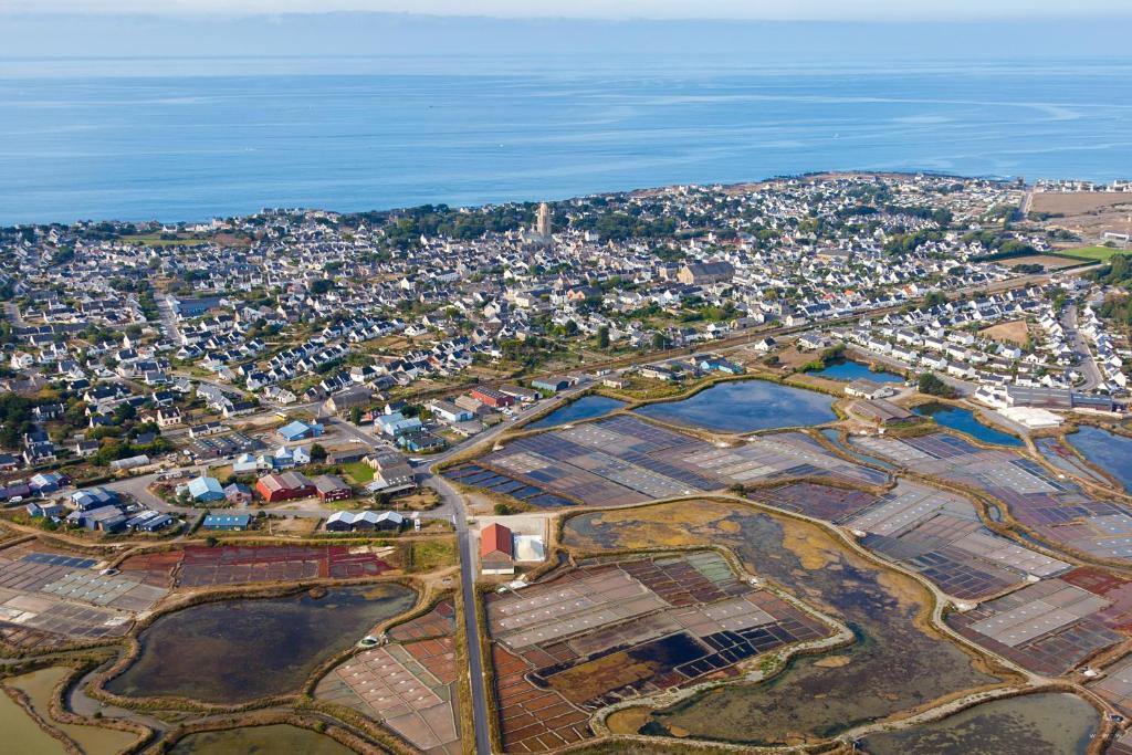 an aerial view of a city next to the water at Maisons de Saint Guenolé in Batz-sur-Mer