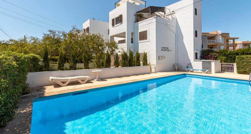 a swimming pool in front of a house at Francisca in Pollença