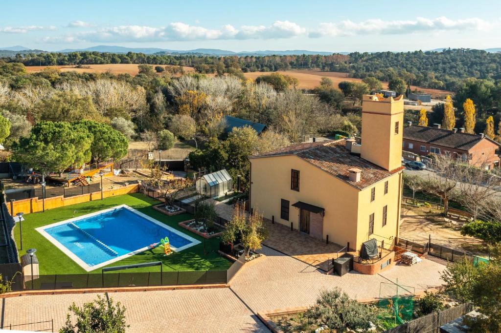 an aerial view of a villa with a swimming pool at Masia Can Divi in La Ametlla