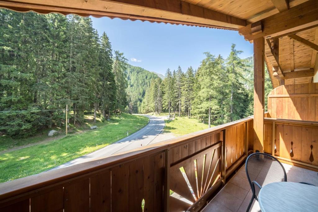 a porch with a view of a road and trees at Ferienhaus Maria Edelweiss in Moso