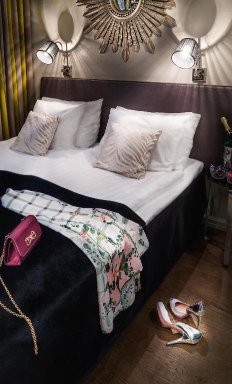 Postel nebo postele na pokoji v ubytování Arctic City Hotel