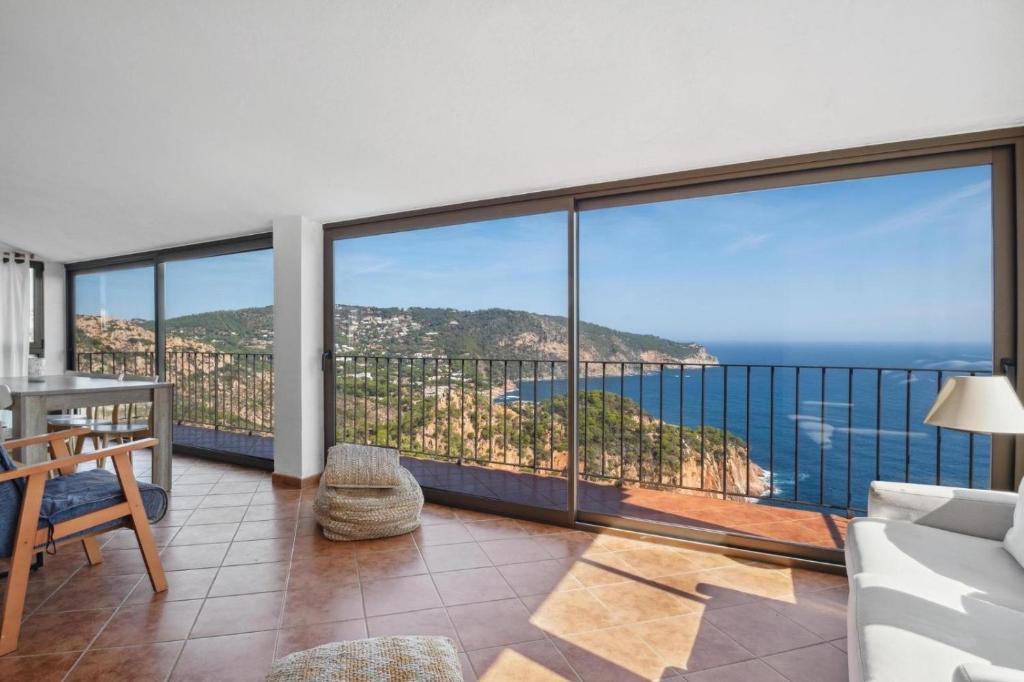 a living room with a view of the ocean at Casa Con Vistas Aiguablava in Tamariu