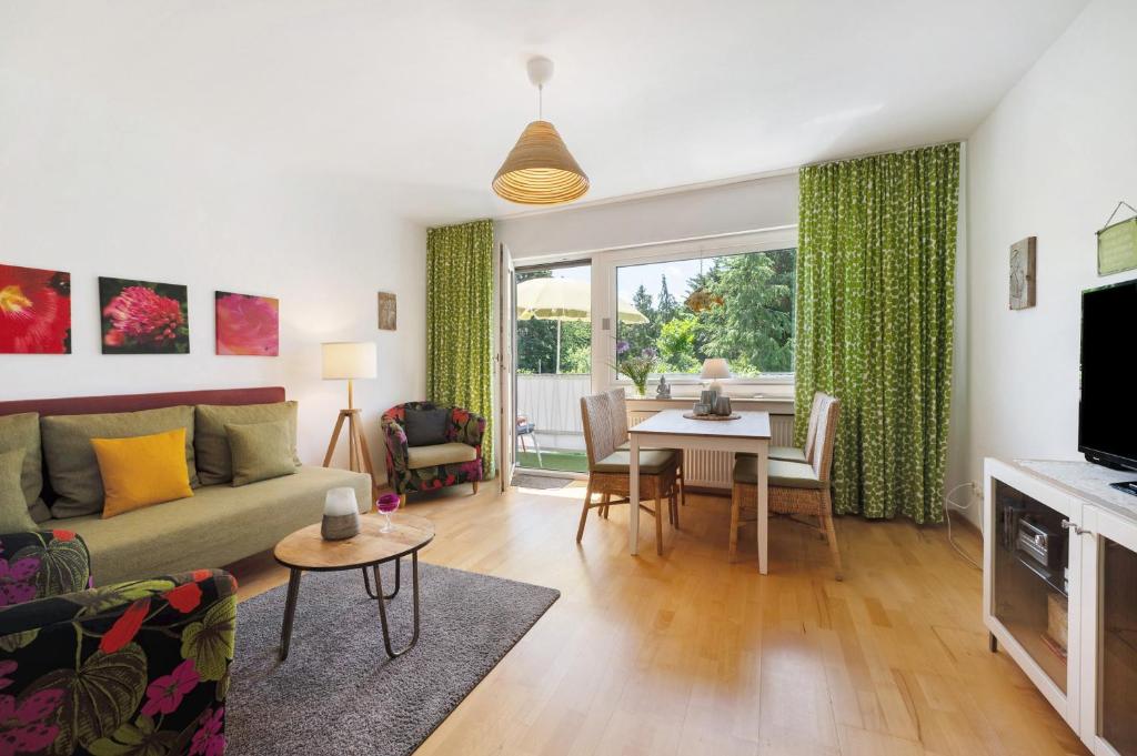 a living room with a couch and a table at Ferienwohnung Bachem mit Balkon in Bad Neuenahr-Ahrweiler