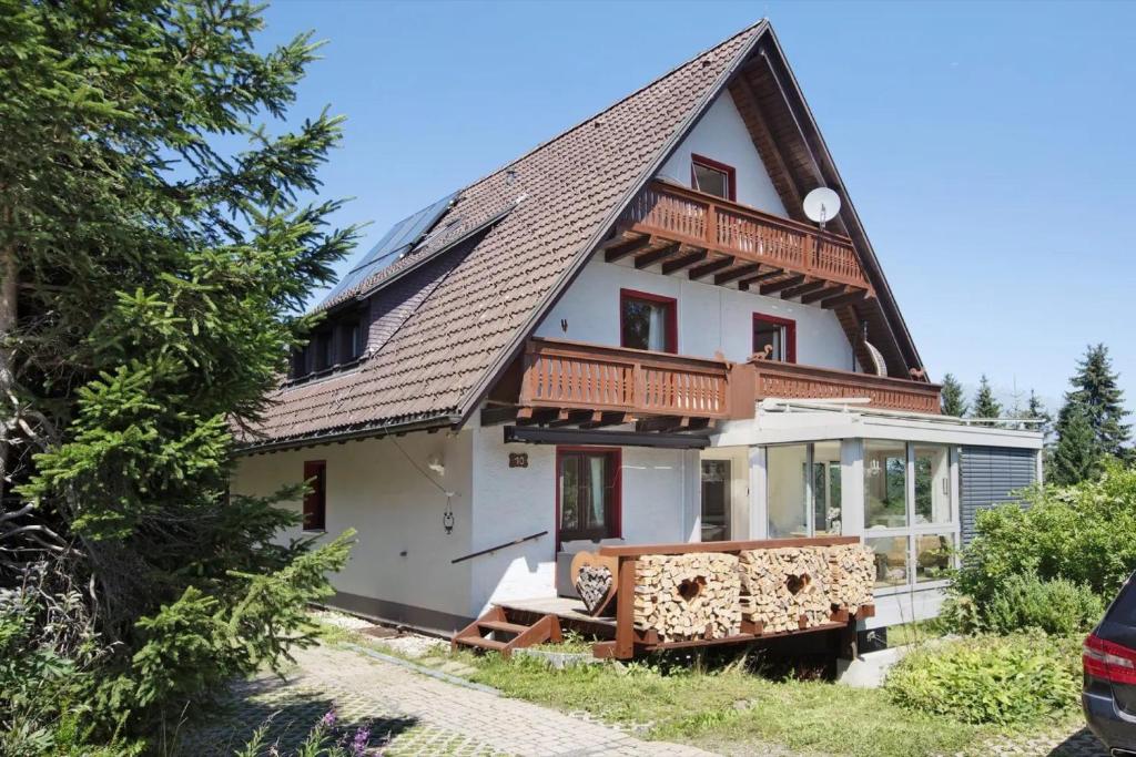 a large white house with a gambrel roof at Haslehaus in Feldberg