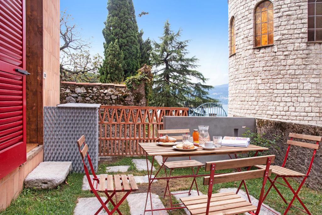 a table and chairs sitting on a patio at Cadepaia Lago Maggiore in Laveno-Mombello