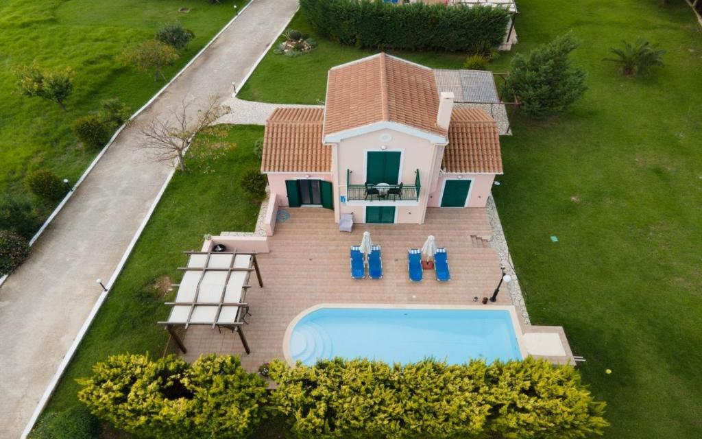 an aerial view of a house with a swimming pool at Sami Beach Villas Thalia in Sami