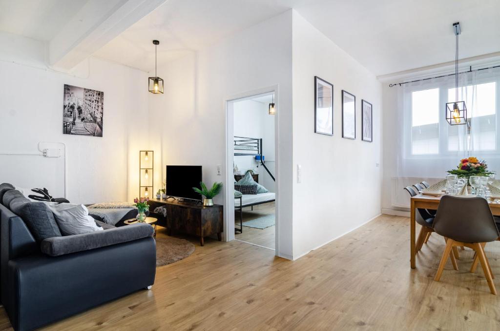 a living room with a couch and a table at Mäxle's Loft Winzeln in Winzeln