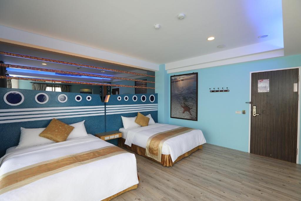 Postel nebo postele na pokoji v ubytování Hang Hai B&B