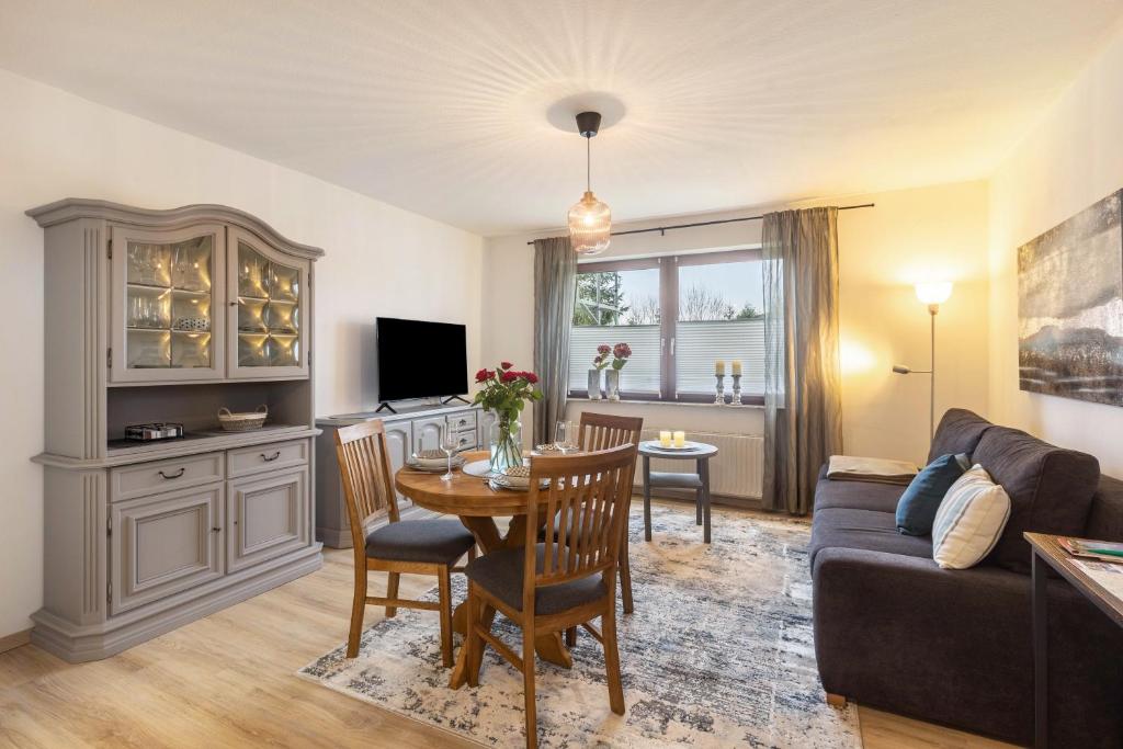 a living room with a table and a couch at Marla in Lauterbach