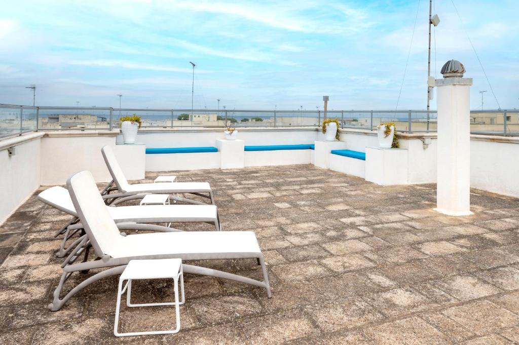 a balcony with chairs and a view of the ocean at Case Vacanze Otranto in Otranto