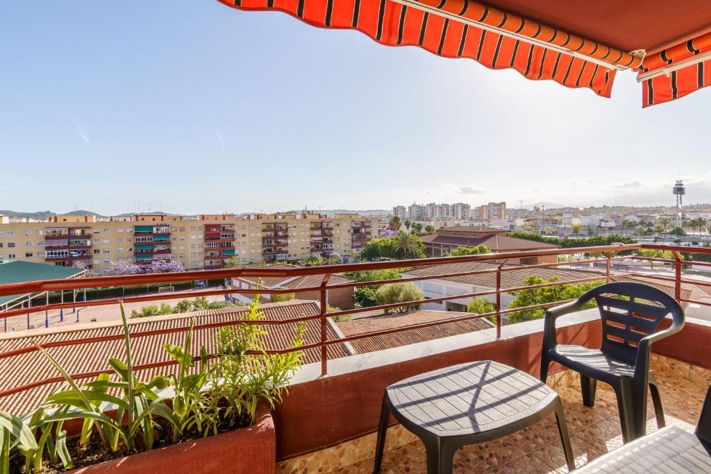 a balcony with two chairs and a table at Apartamento Carmen in Fuengirola