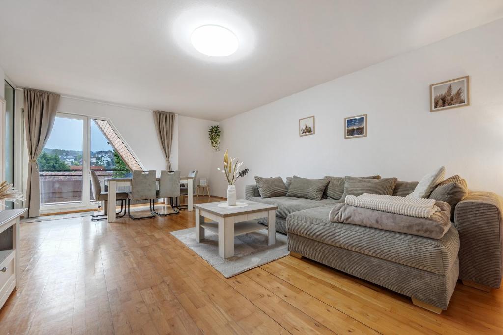 a living room with a couch and a table at Ferienwohnung Berti in Heeßen