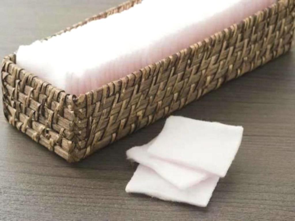 a wicker basket with two white napkins in it at Dormy Inn Akihabara in Tokyo