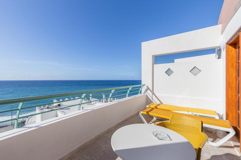 a balcony with a view of the ocean on a cruise ship at Playa Delphin 306 in Puerto Naos
