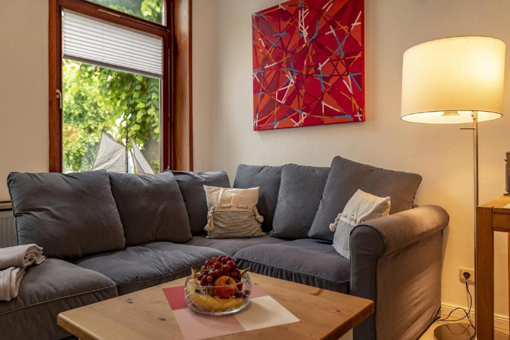 a living room with a couch and a table at Ferienwohnungen Wiese - Nickel 2 in Arnis