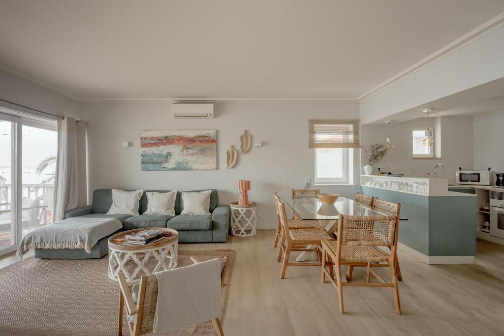 a living room with a couch and a table at Cascais Bay Terrace I in Cascais