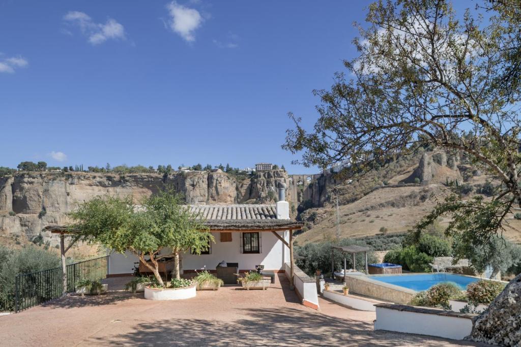 a house with a view of a mountain at El Puente Ronda in Ronda