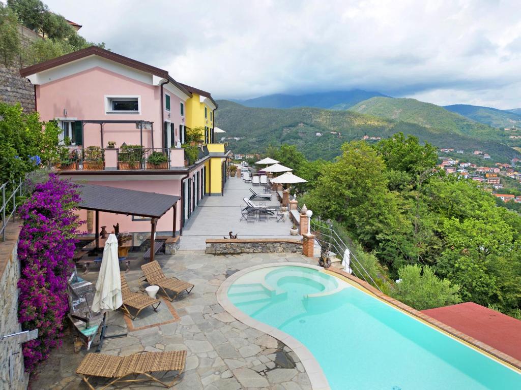 a view of a hotel with a swimming pool at Villa Lice - Vigneto in Casarza Ligure