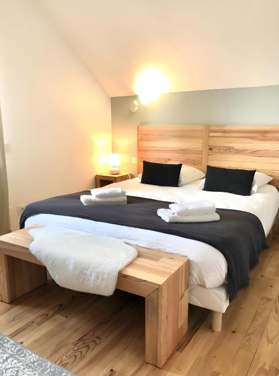 two beds in a room with two beds sidx sidx sidx at Gite Fleur De Miel in Saffloz