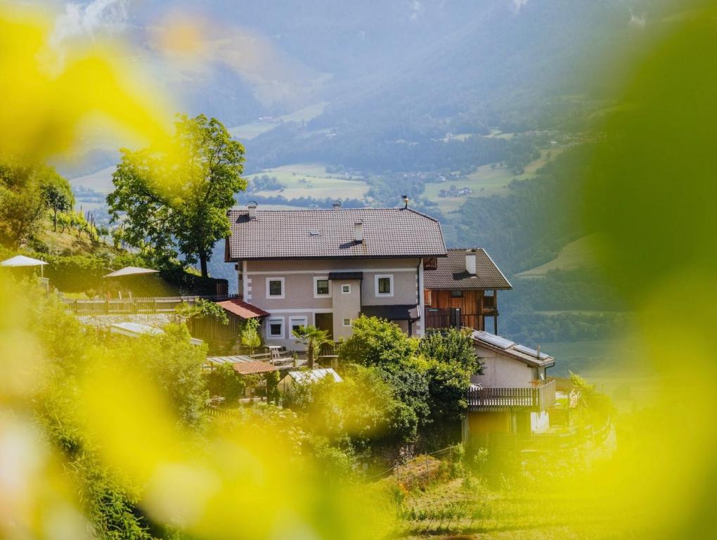 a house sitting on top of a hill at Maso Fallmerayer - Fallmerayerhof in Bressanone