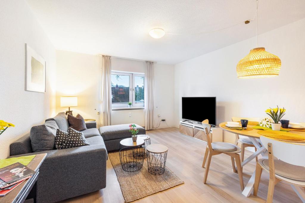 a living room with a couch and a table at Wohnung Horsti in Timmendorfer Strand