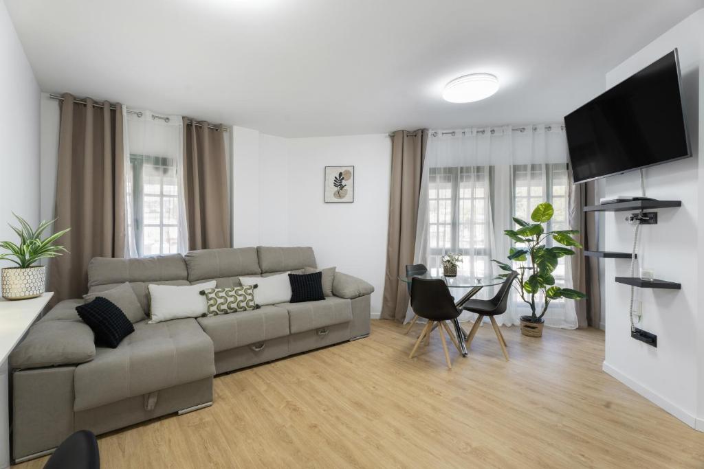a living room with a couch and a table at Apartamento Calecampo in Candelaria