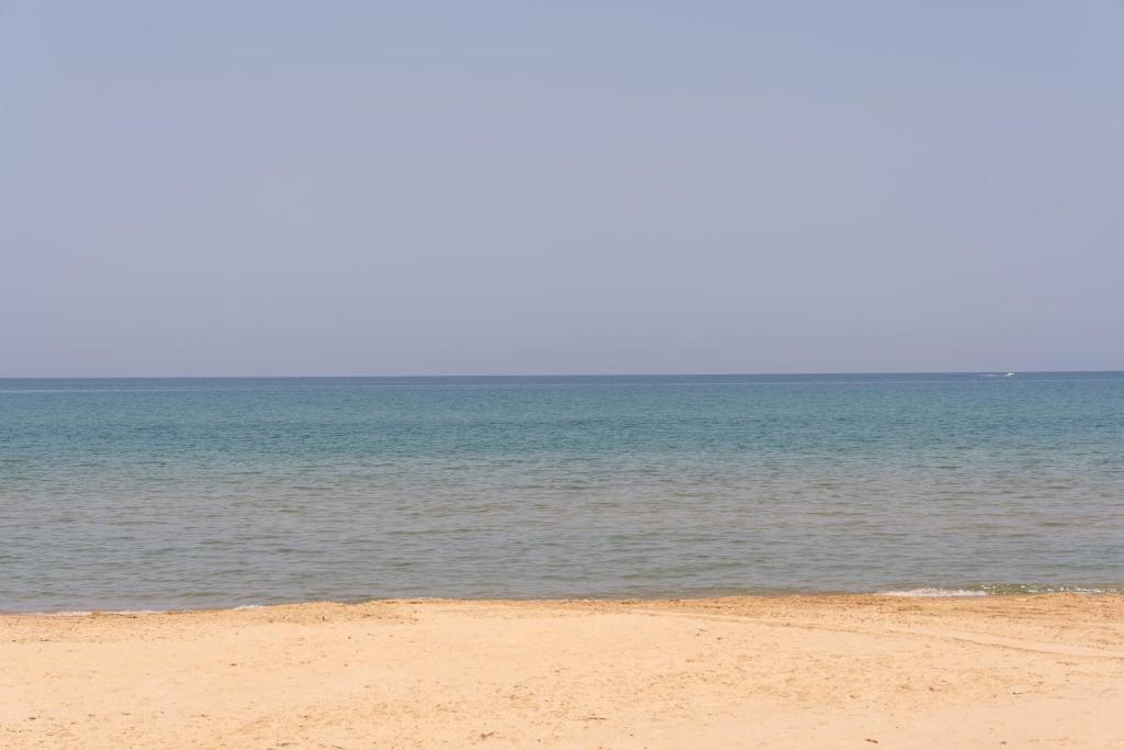 a sandy beach with the ocean in the background at Sea Nest in Balestrate