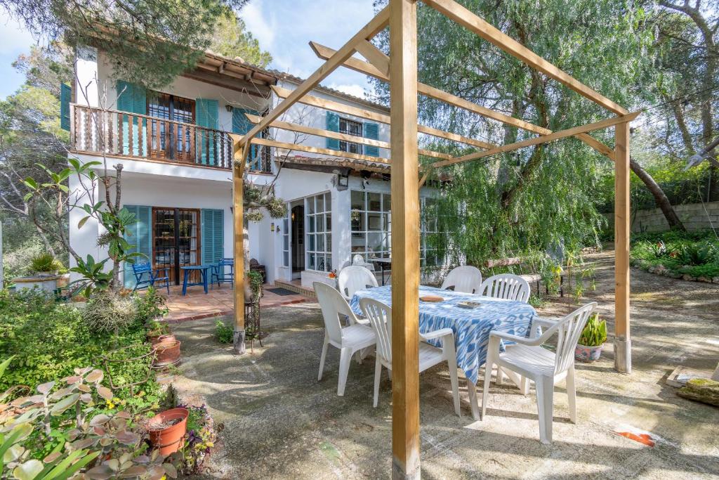 a table and chairs in front of a house at Son Oliver in Palma de Mallorca