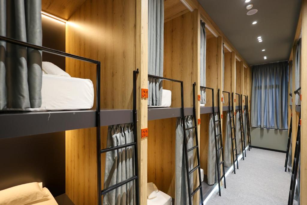a row of bunk beds in a dorm room at Grand Hostel Berat in Berat