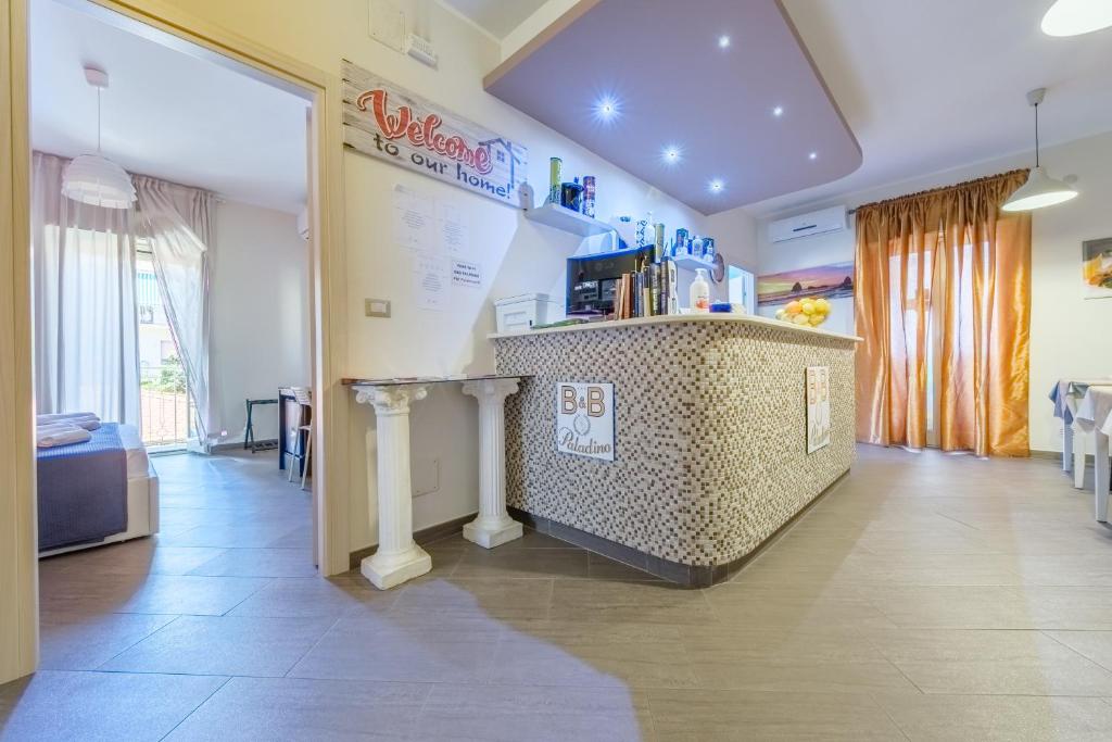 a room with a counter in a room at Paladino in Giardini Naxos