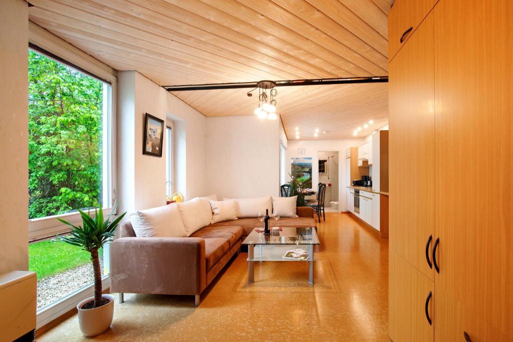 a living room with a couch and a table at Stumpp´s Appartement in Heroldstatt