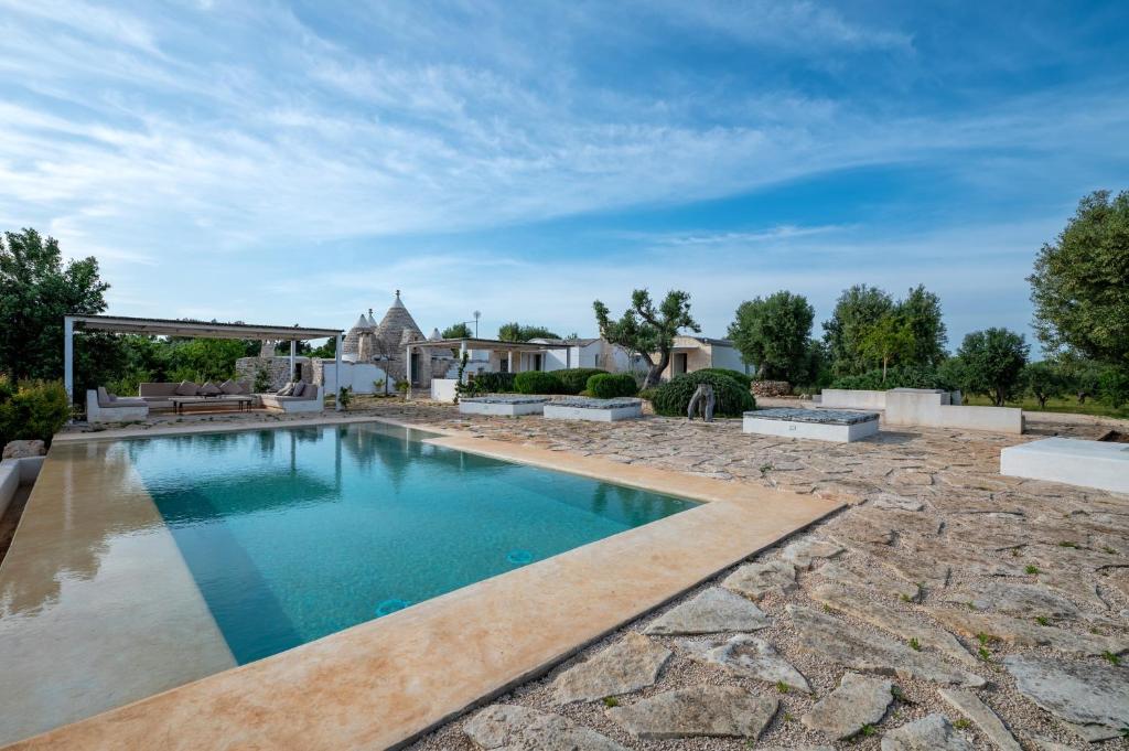 an image of a swimming pool in a yard at Trullo Nostress with pool in Ceglie Messapica