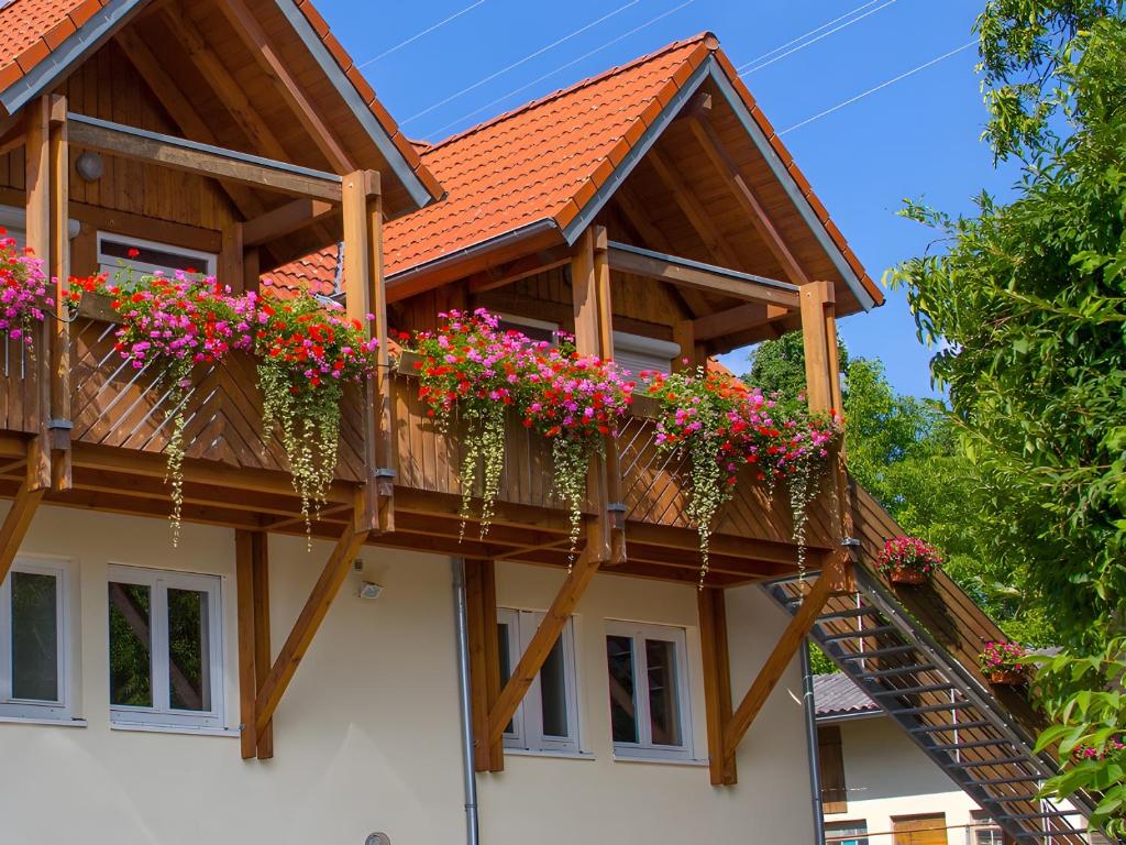 a house with flower boxes on the balcony at Ferienhof Dreher in Meersburg