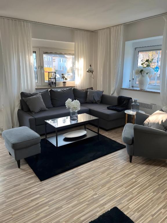 a living room with a couch and a coffee table at Apartments Neckarsulm in Neckarsulm