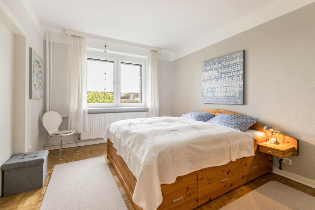 a bedroom with a large bed and a window at Alte Schule Pahlkrug in Linden