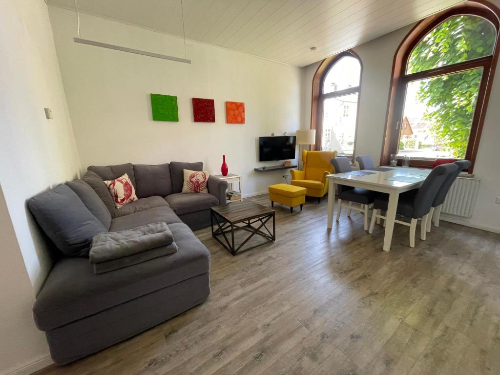a living room with a couch and a table at Ferienwohnungen Wiese - Nickel 1 in Arnis