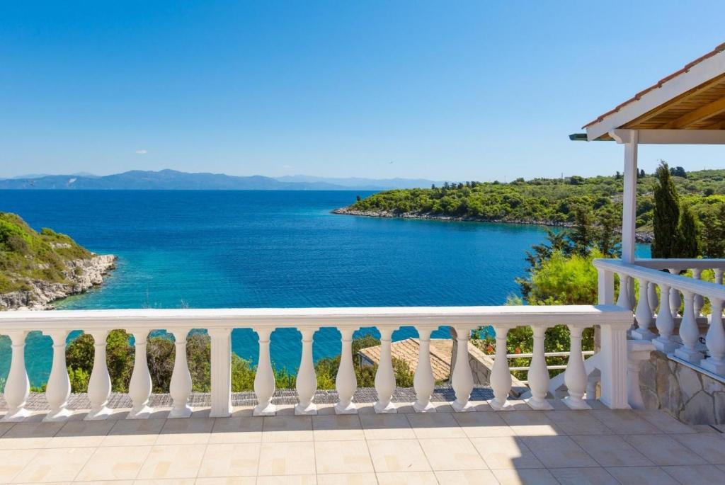 a balcony with a view of the ocean at Dolphin villa 3 in Gaios